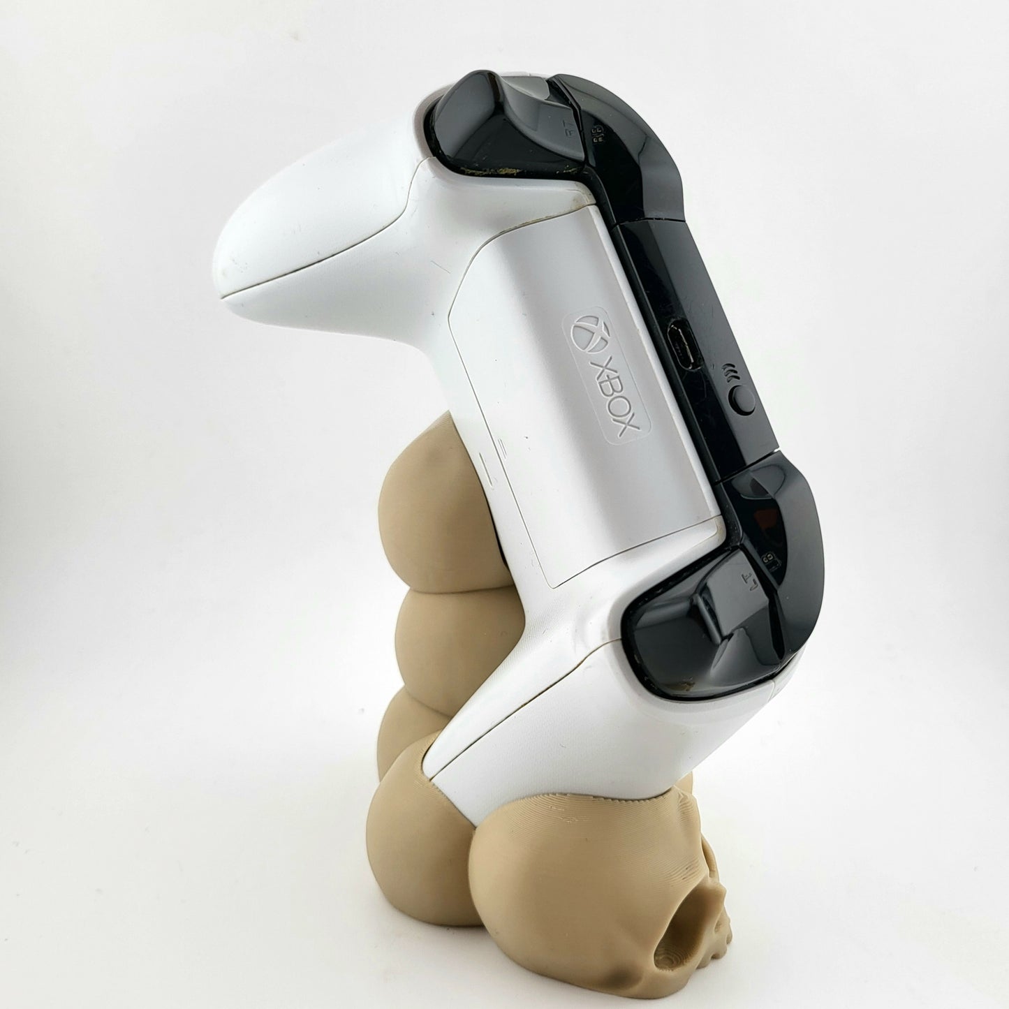 One xbox controller stand featuring a skull tower design , 3D printed with high-quality PLA.