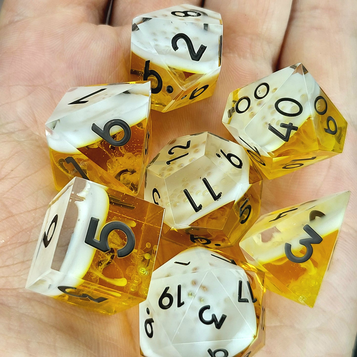 Handmade sharp edge resin dice set inspired by beer white foam effect and black numbers for Dungeons and Dragons tabletop RPGs