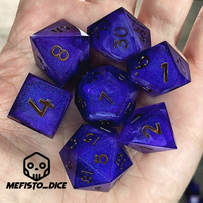 Deep blue and purple shimmering resin DnD dice set with gold numbers