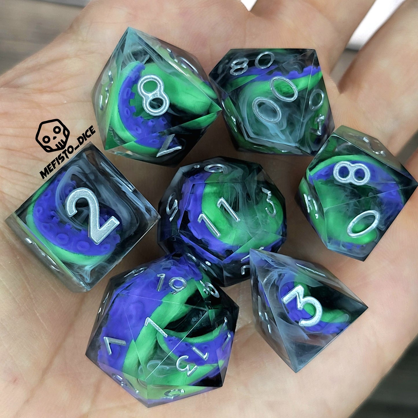 Handcrafted sharp edge resin dice featuring eerie green and purple tentacles suspended in dark transparent resin, surrounded by ghostly white mist and finished with metallic silver numbers
