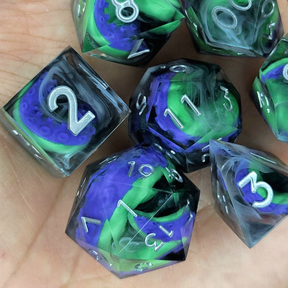 Handcrafted sharp edge resin dice featuring eerie green and purple tentacles suspended in dark transparent resin, surrounded by ghostly white mist and finished with metallic silver numbers