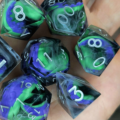 Handcrafted sharp edge resin dice featuring eerie green and purple tentacles suspended in dark transparent resin, surrounded by ghostly white mist and finished with metallic silver numbers