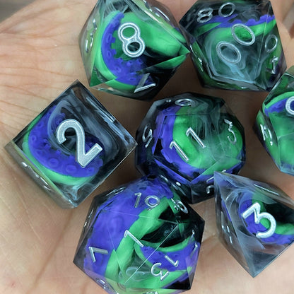 Handcrafted sharp edge resin dice featuring eerie green and purple tentacles suspended in dark transparent resin, surrounded by ghostly white mist and finished with metallic silver numbers