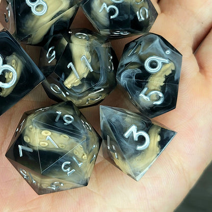 Handcrafted sharp edge resin dice featuring eerie brown tentacles suspended in dark transparent resin, surrounded by ghostly white mist and finished with metallic silver numbers