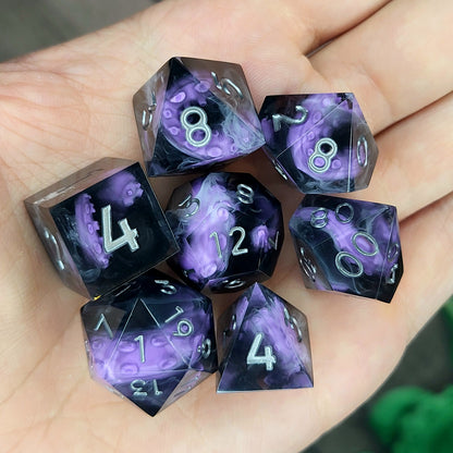 Handcrafted sharp edge resin dice featuring eerie purple tentacles suspended in dark transparent resin, surrounded by ghostly white mist and finished with metallic silver numbers