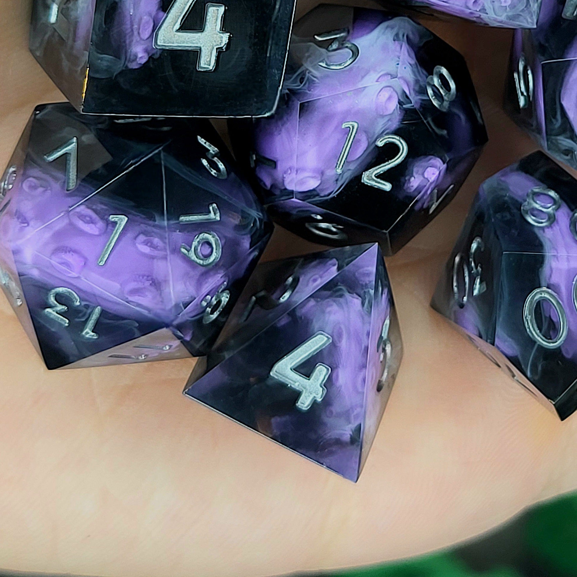 Handcrafted sharp edge resin dice featuring eerie purple tentacles suspended in dark transparent resin, surrounded by ghostly white mist and finished with metallic silver numbers