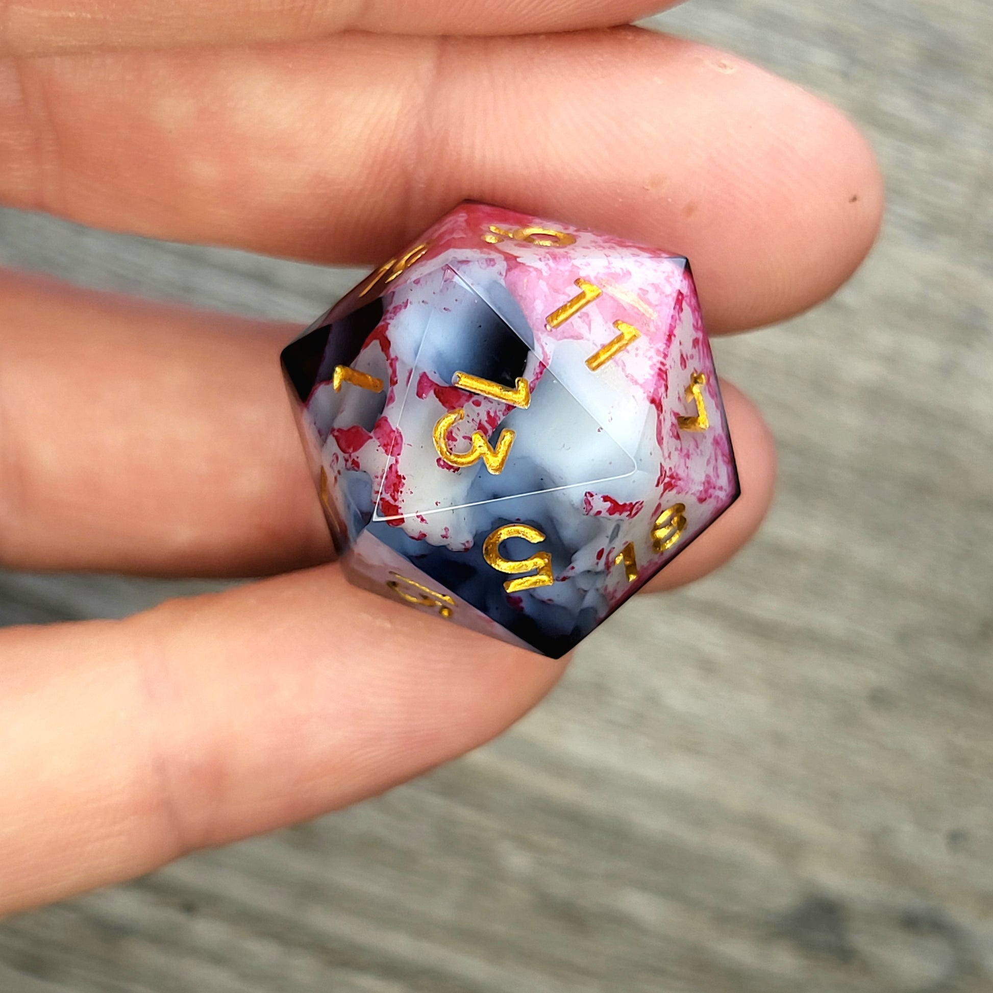 D20 dice with white skull inside , gold numbers for play dnd , dungeons and dragons