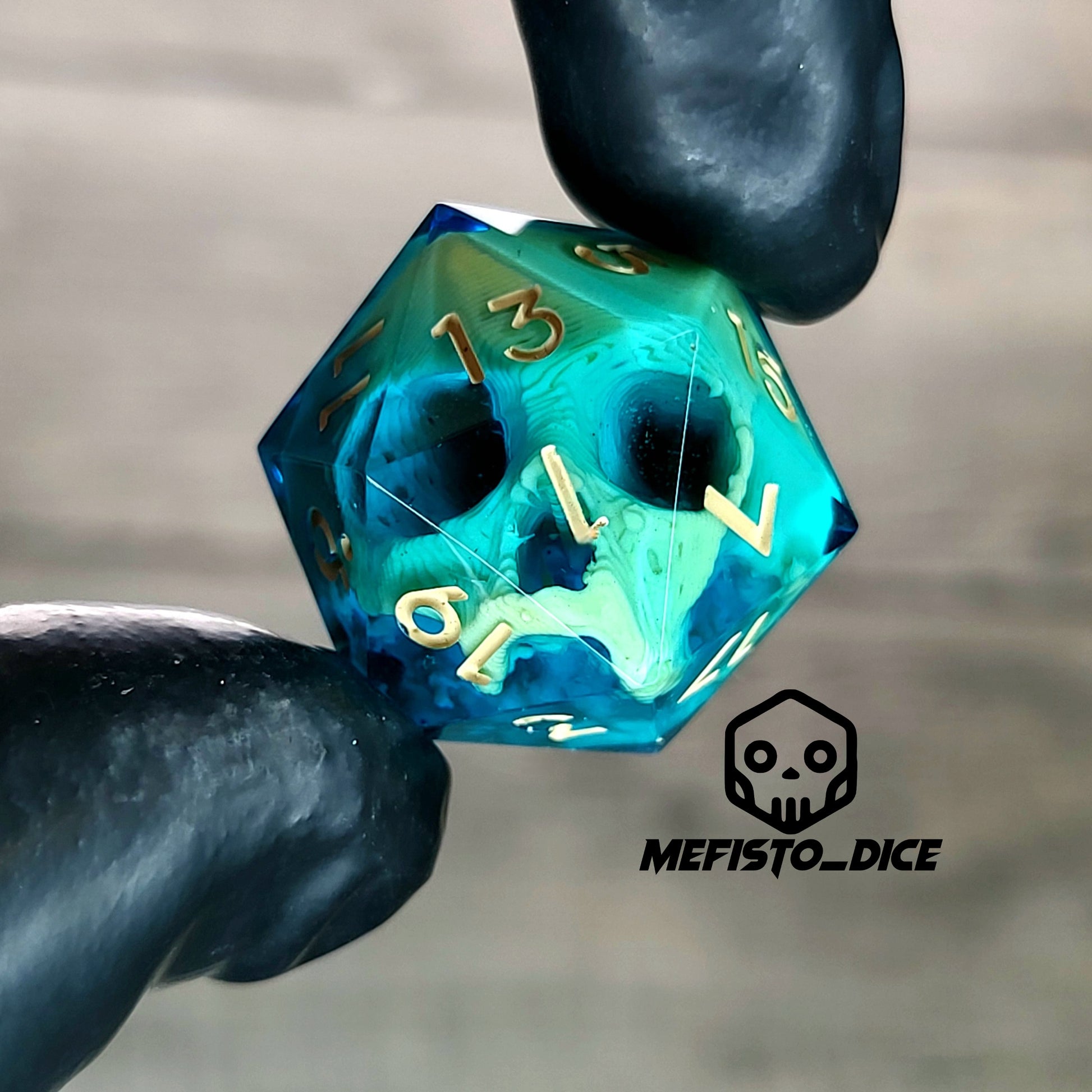 This is a single set of one D20 die with a light brown skull inside , blue resin and light brown numbers for play dnd dungeons and dragons
