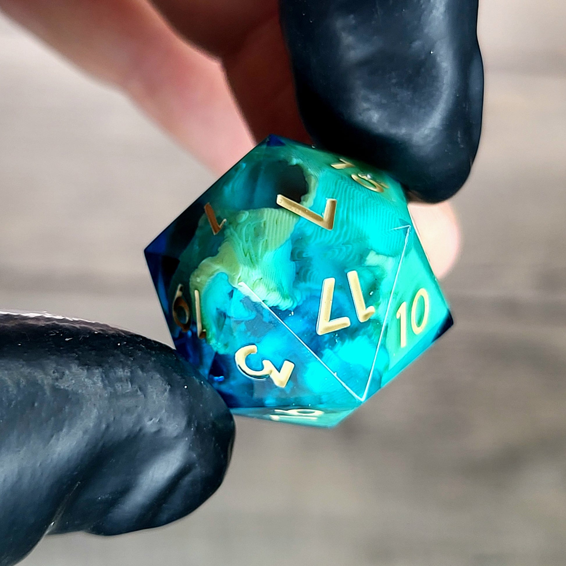 This is a single set of one D20 die with a light brown skull inside , blue resin and light brown numbers for play dnd dungeons and dragons