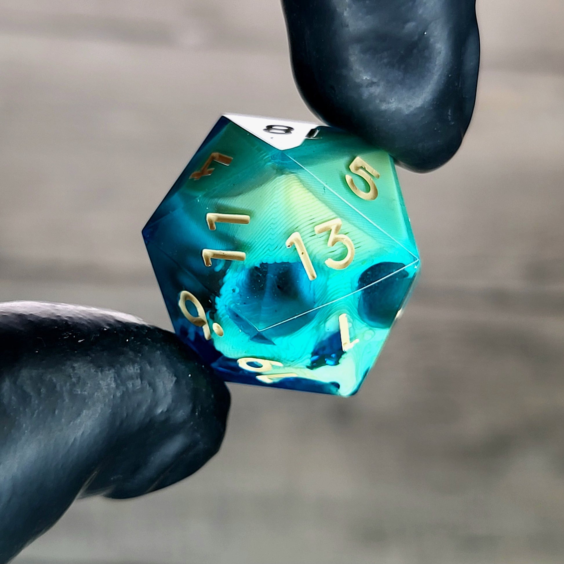 This is a single set of one D20 die with a light brown skull inside , blue resin and light brown numbers for play dnd dungeons and dragons