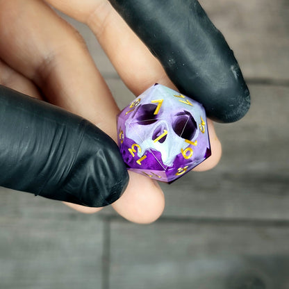 This is a single set of one D20 DnD die with a light green skull inside , purple resin and gold numbers