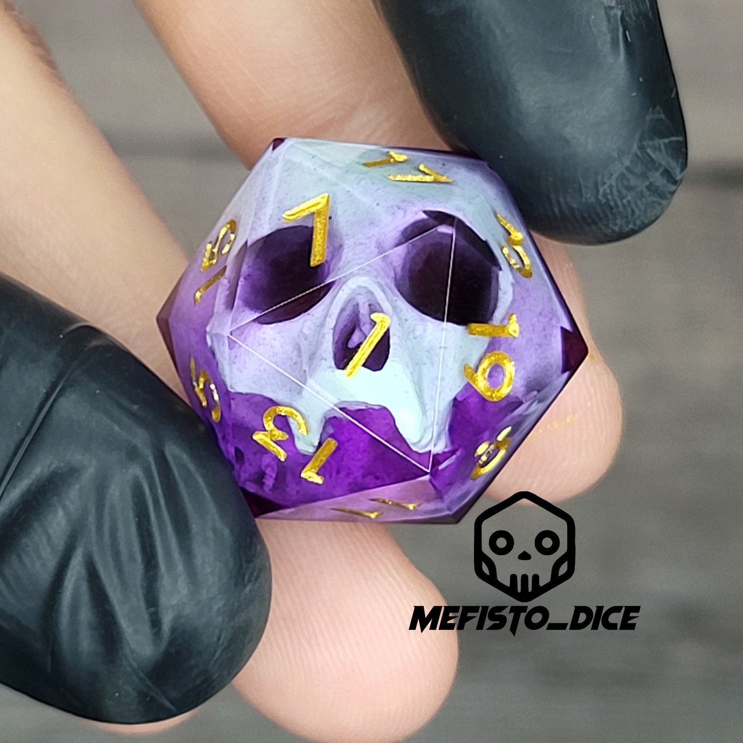 This is a single set of one D20 DnD die with a light green skull inside , purple resin and gold numbers