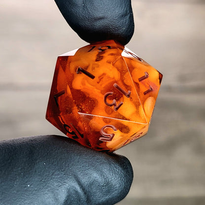 This is a single set of one D20 DnD die with a white spirit inside , orange resin and red numbers