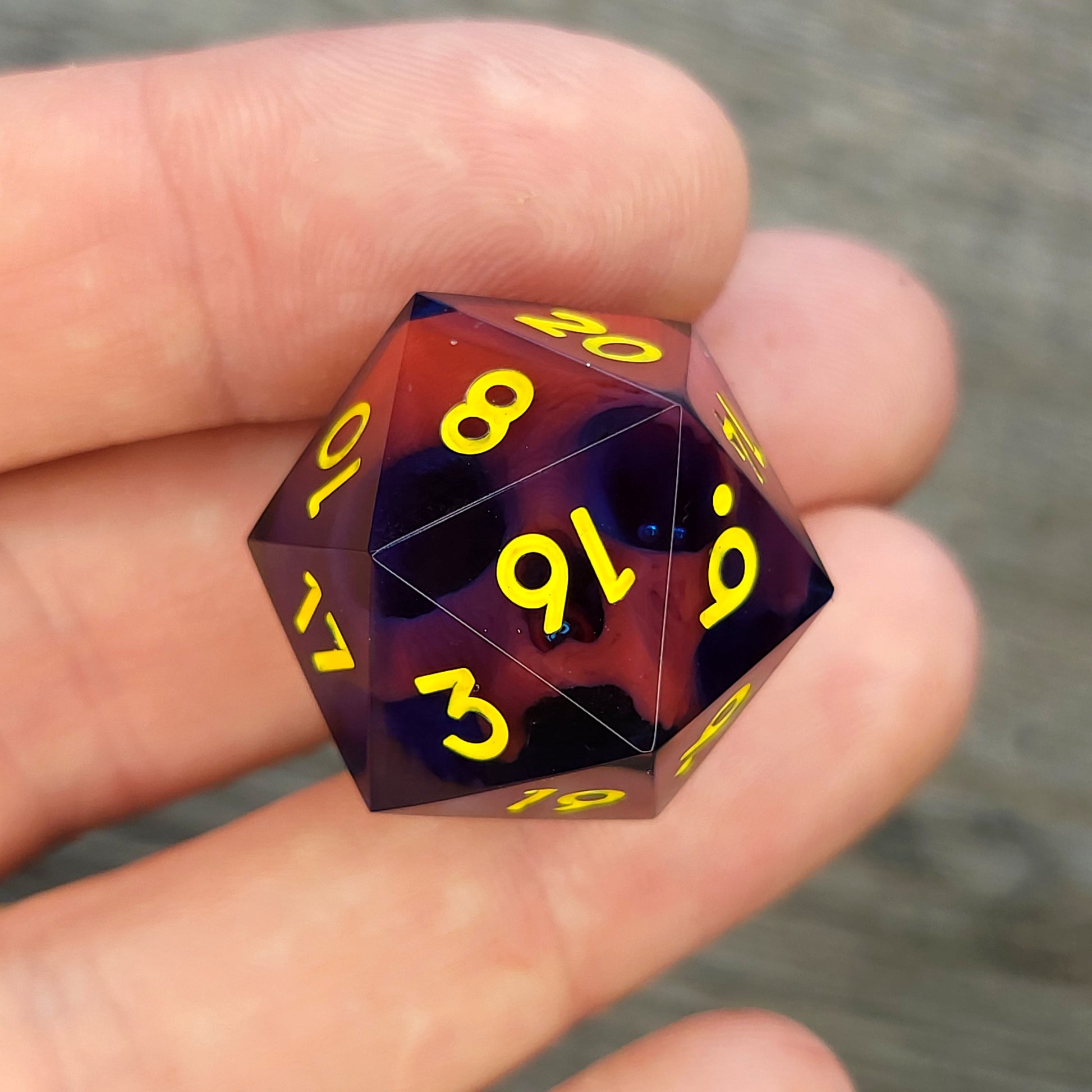 D20 dice with red skull inside , yellow numbers for play dnd , dungeons and dragons