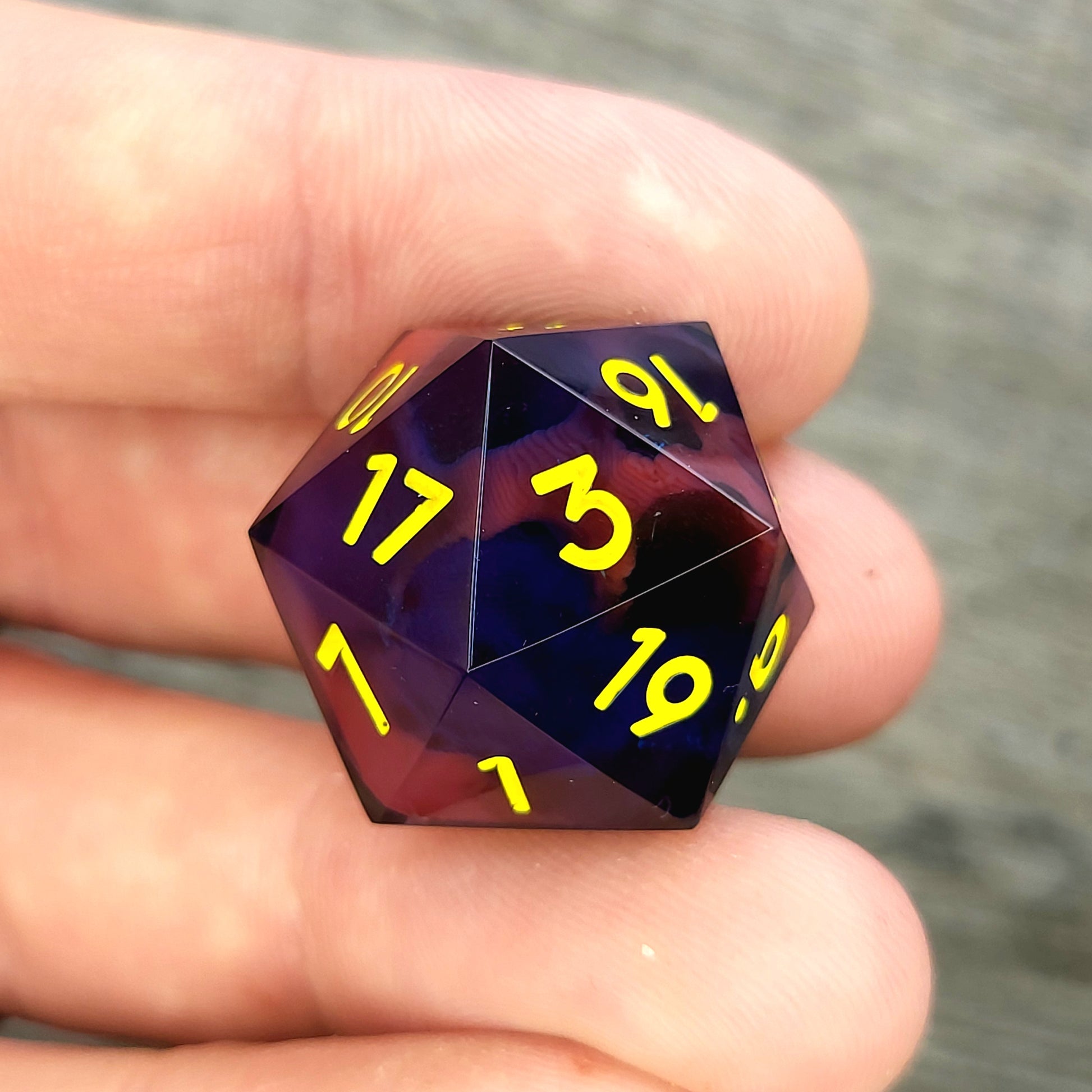 D20 dice with red skull inside , yellow numbers for play dnd , dungeons and dragons