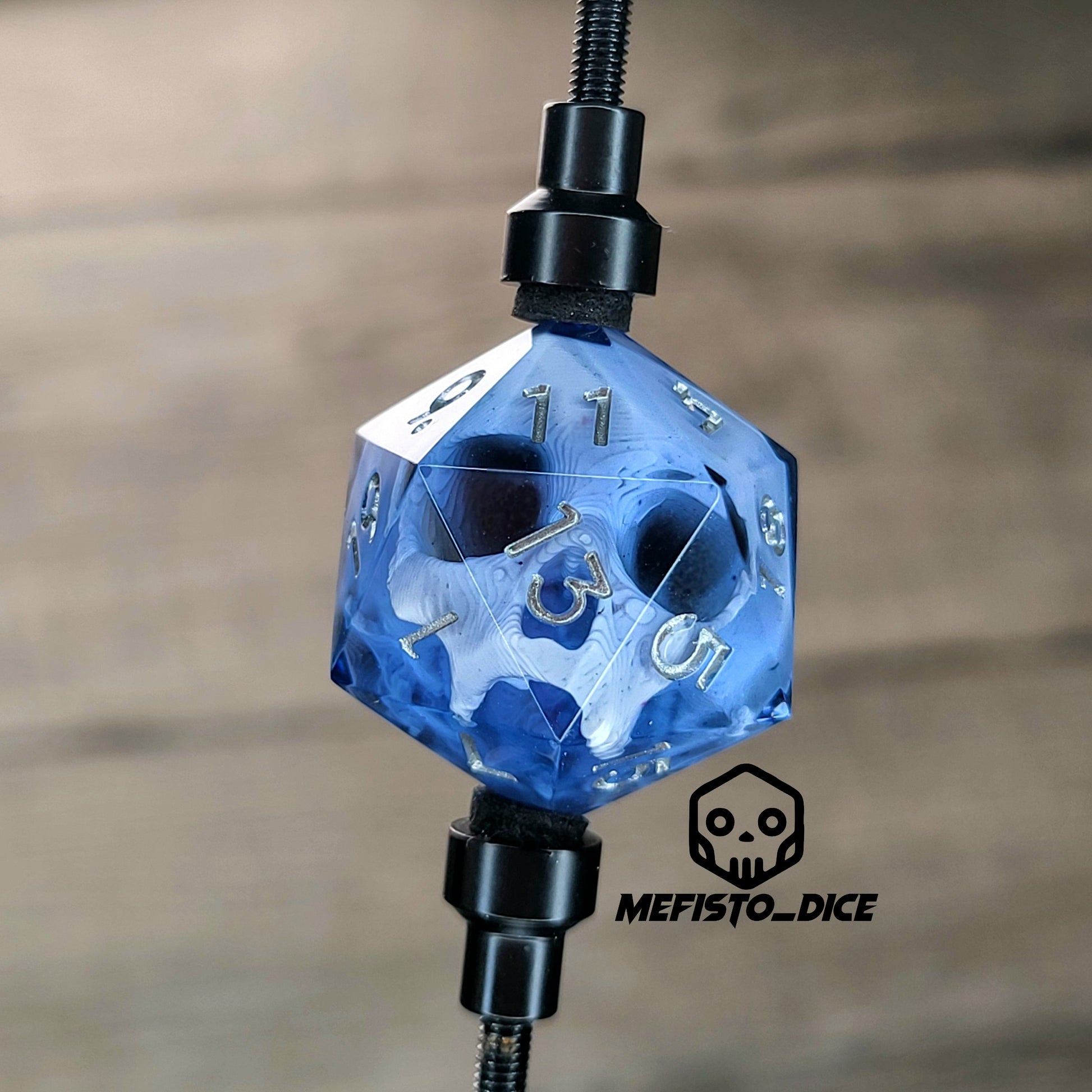 This is a single set of one D20 DnD die with a white skull inside , black resin and silver numbers