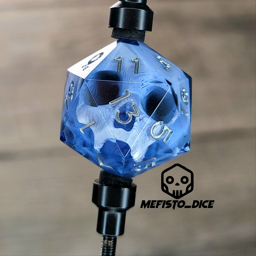 This is a single set of one D20 DnD die with a white skull inside , black resin and silver numbers