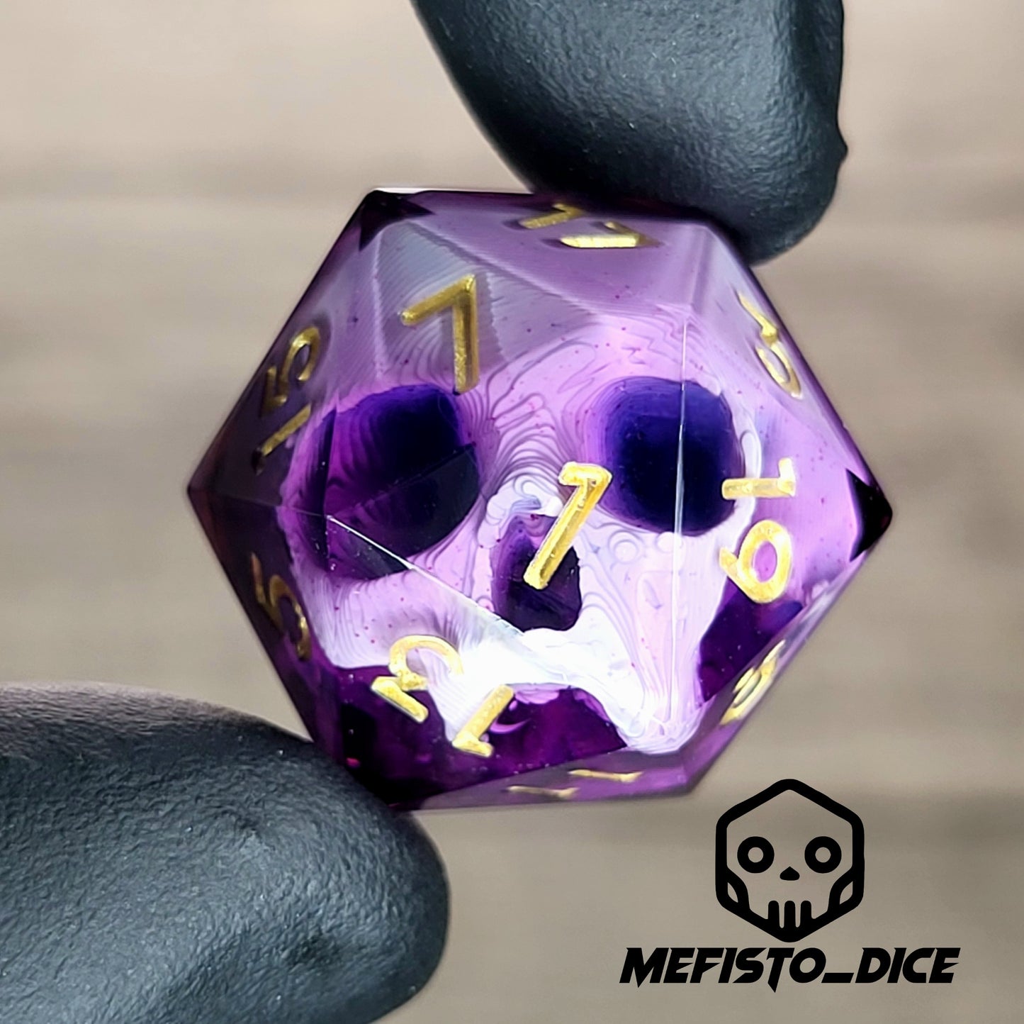 This is a single set of one D20 DnD die with a white skull inside , purple resin and gold numbers