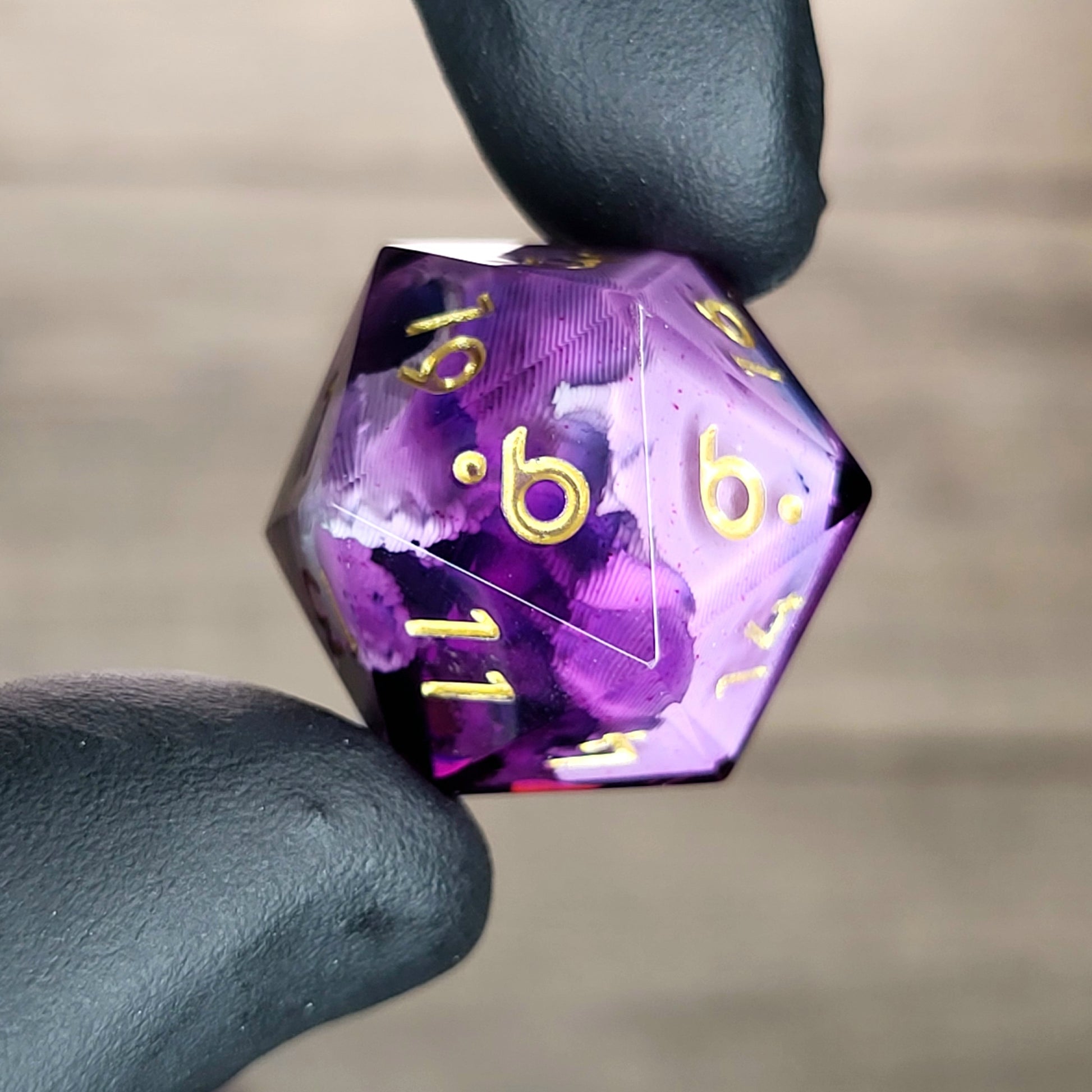 This is a single set of one D20 DnD die with a white skull inside , purple resin and gold numbers