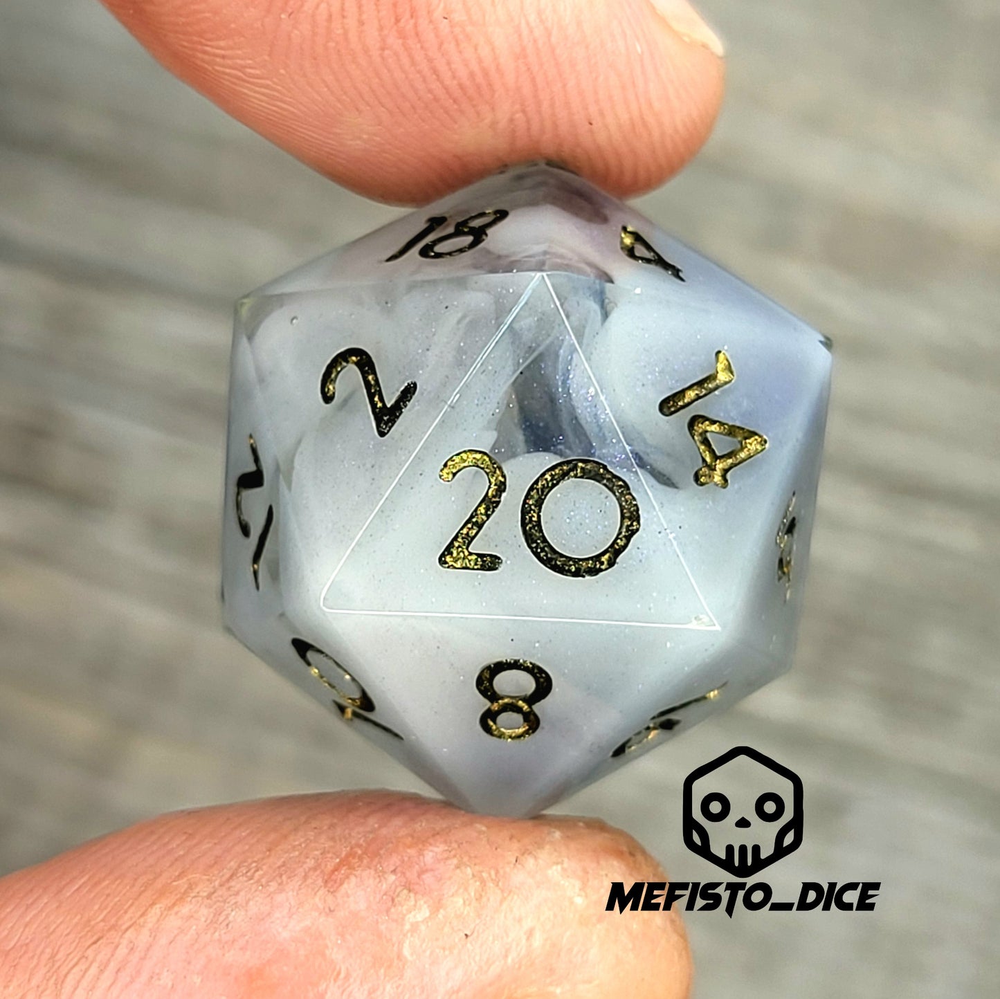 D20 dice with blue white galaxy color inside , black and gold numbers for play dnd , dungeons and dragons