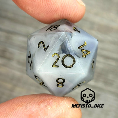 D20 dice with blue white galaxy color inside , black and gold numbers for play dnd , dungeons and dragons