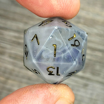 D20 dice with blue white galaxy color inside , black and gold numbers for play dnd , dungeons and dragons