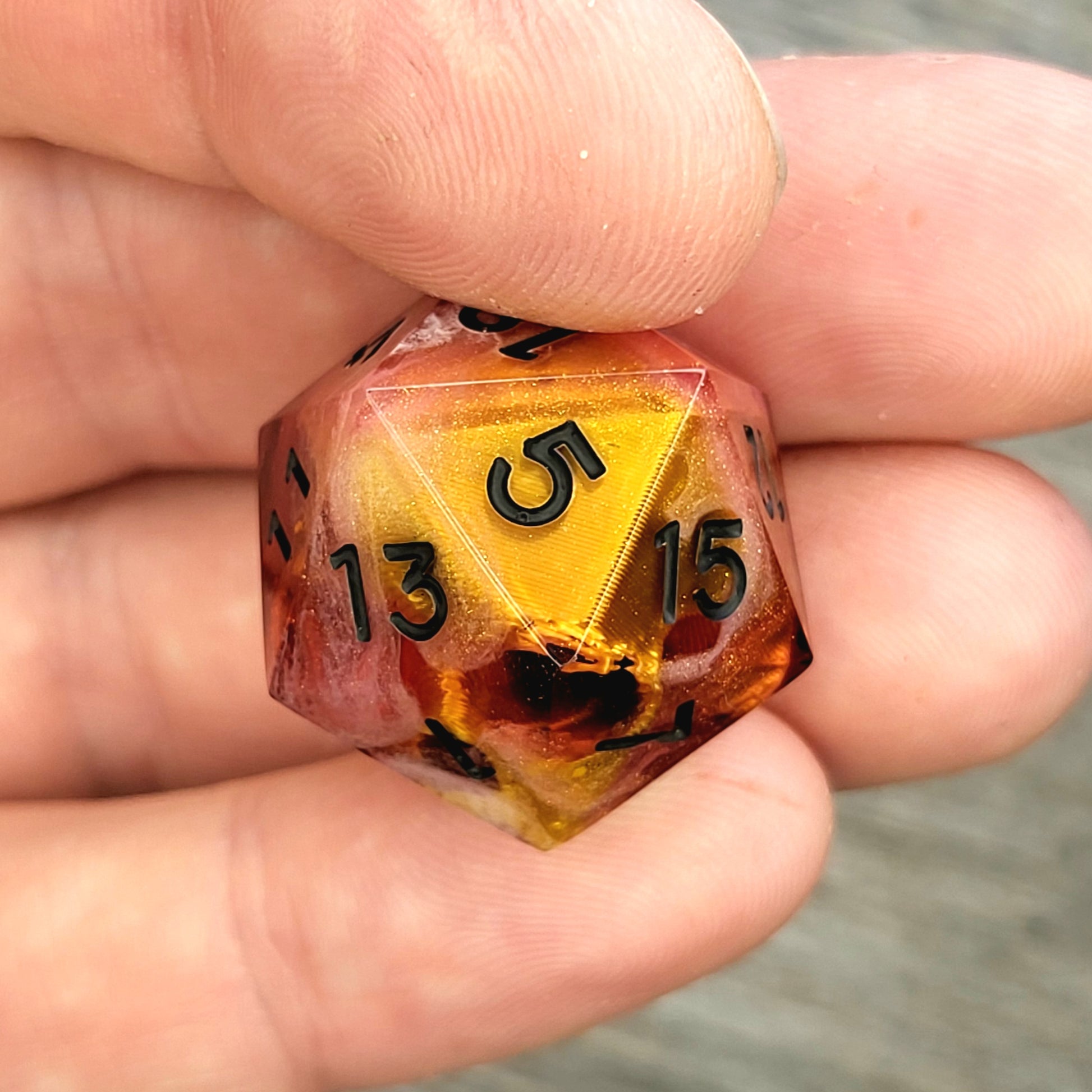 D20 dice with gold skull inside , black numbers for play dnd , dungeons and dragons