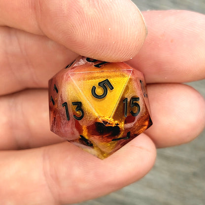 D20 dice with gold skull inside , black numbers for play dnd , dungeons and dragons