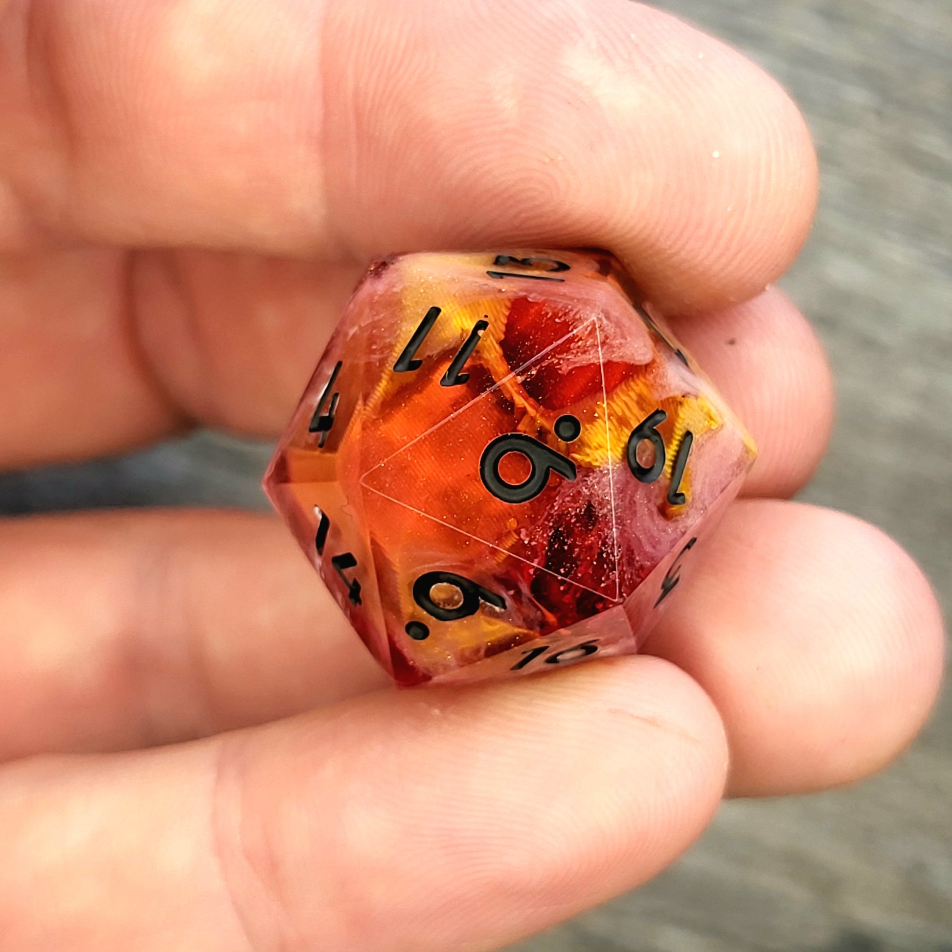D20 dice with gold skull inside , black numbers for play dnd , dungeons and dragons