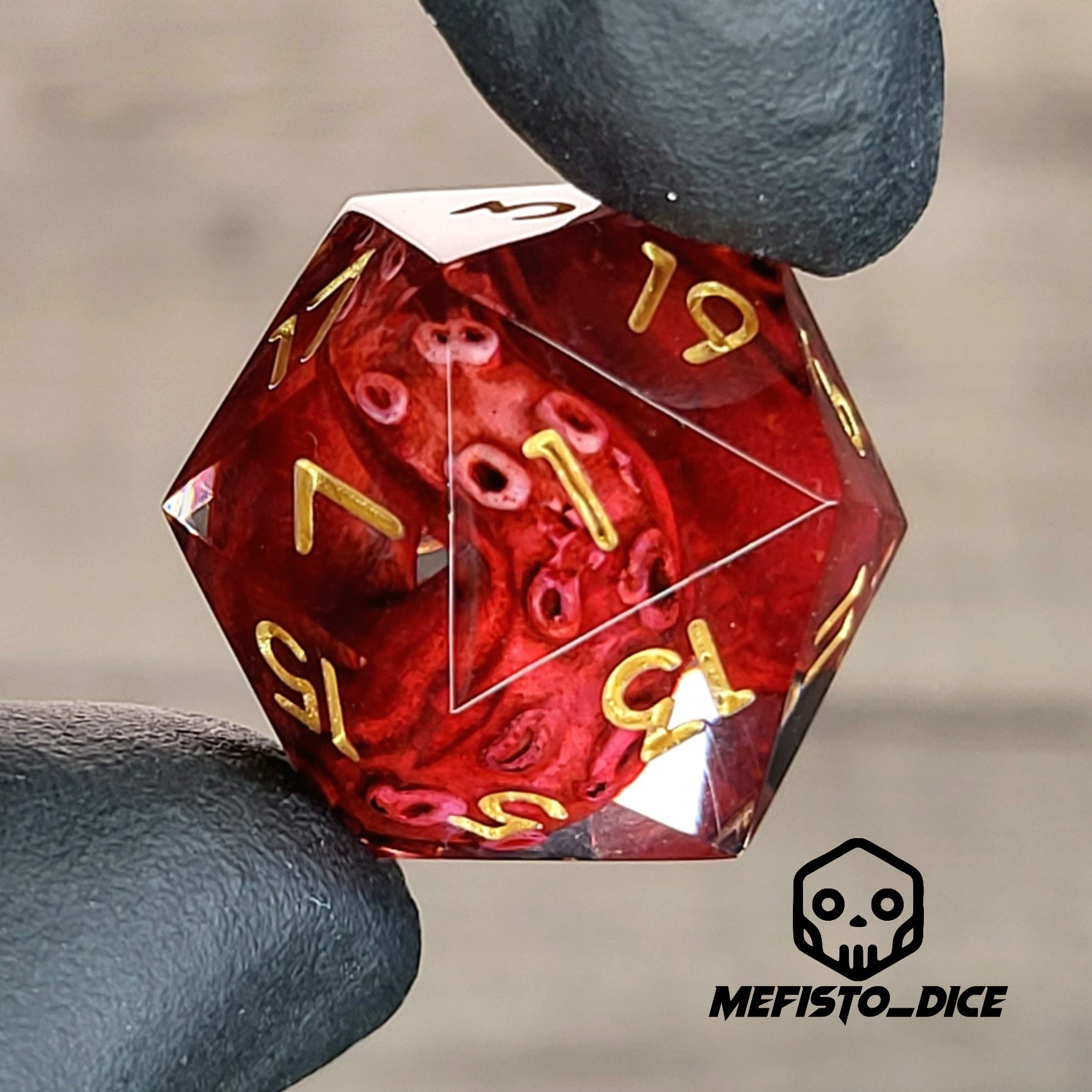 D20 dice with red tentacles inside and gold numbers for play dnd , dungeons and dragons