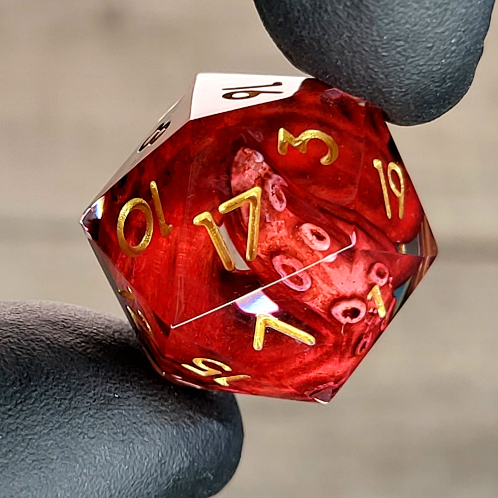 D20 dice with red tentacles inside and gold numbers for play dnd , dungeons and dragons