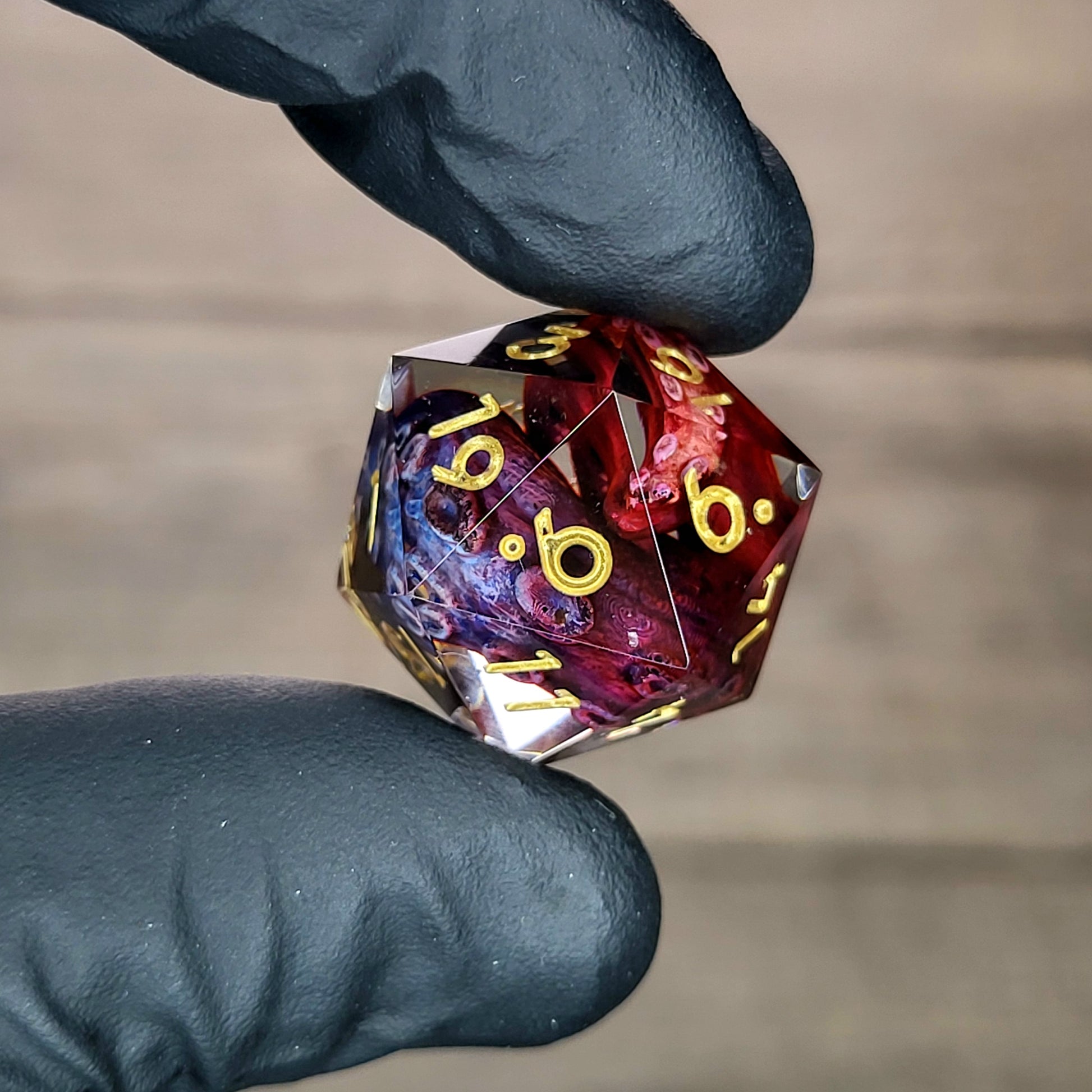 D20 dice with red and blue tentacles inside and gold numbers for play dnd , dungeons and dragons