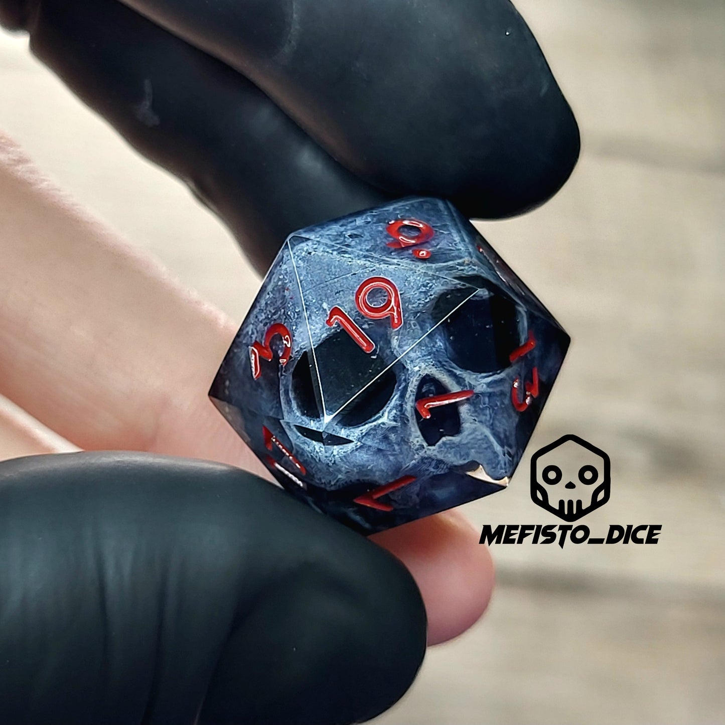 This is a single set of one D20 DnD die with a dark grey skull inside ,black resin and red numbers