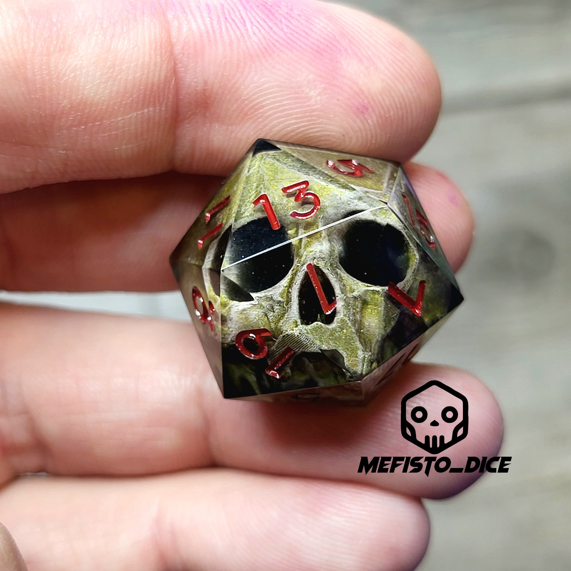 This is a single set of one D20 DND die with a light brown skull inside ,black resin and red numbers