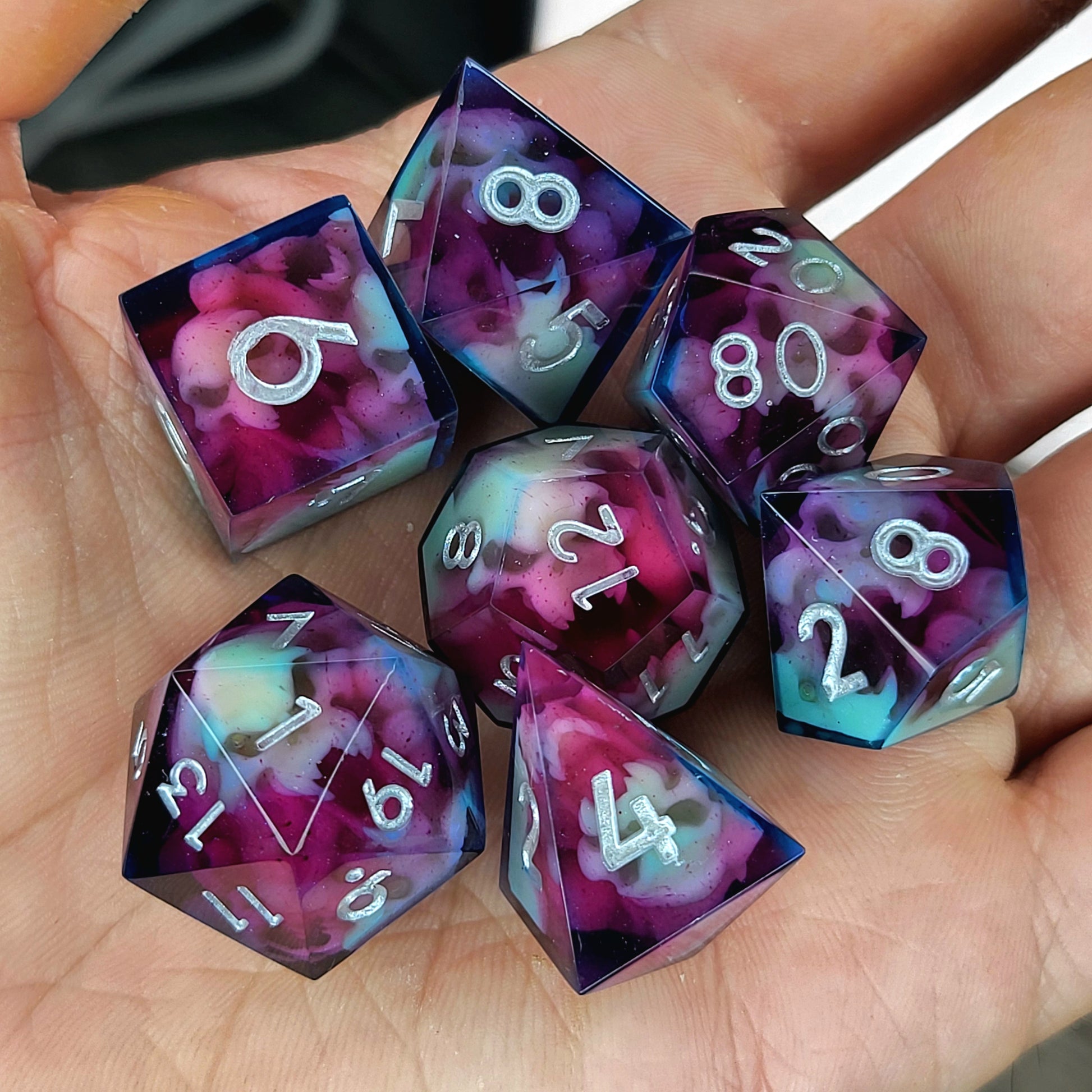 Dice set with red and blue spirit inside and silver numbers for play dnd , dungeons and dragons