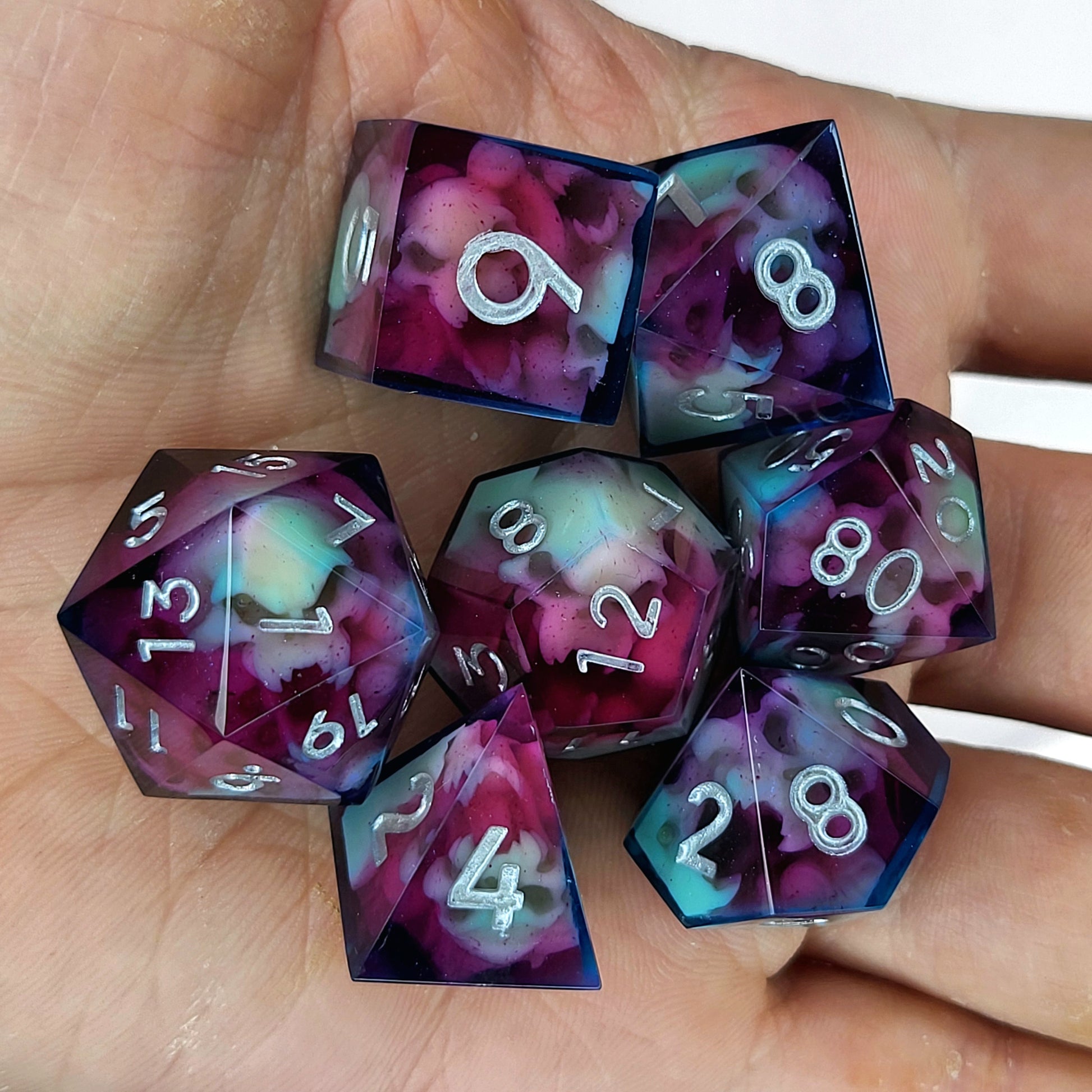 Dice set with red and blue spirit inside and silver numbers for play dnd , dungeons and dragons