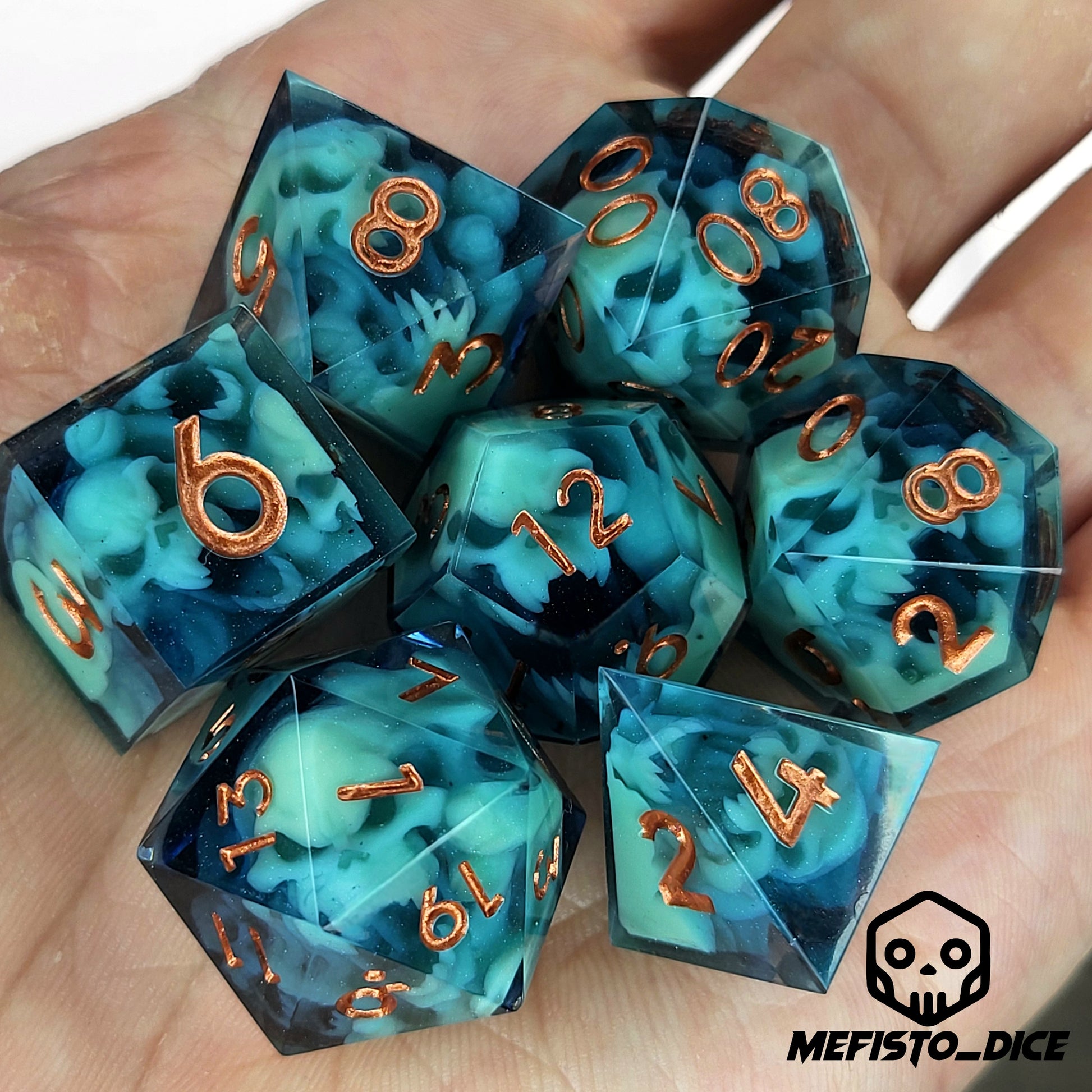 Dice set with green spirit inside and bronze numbers for play dnd , dungeons and dragons