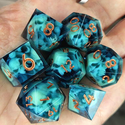 Dice set with green spirit inside and bronze numbers for play dnd , dungeons and dragons