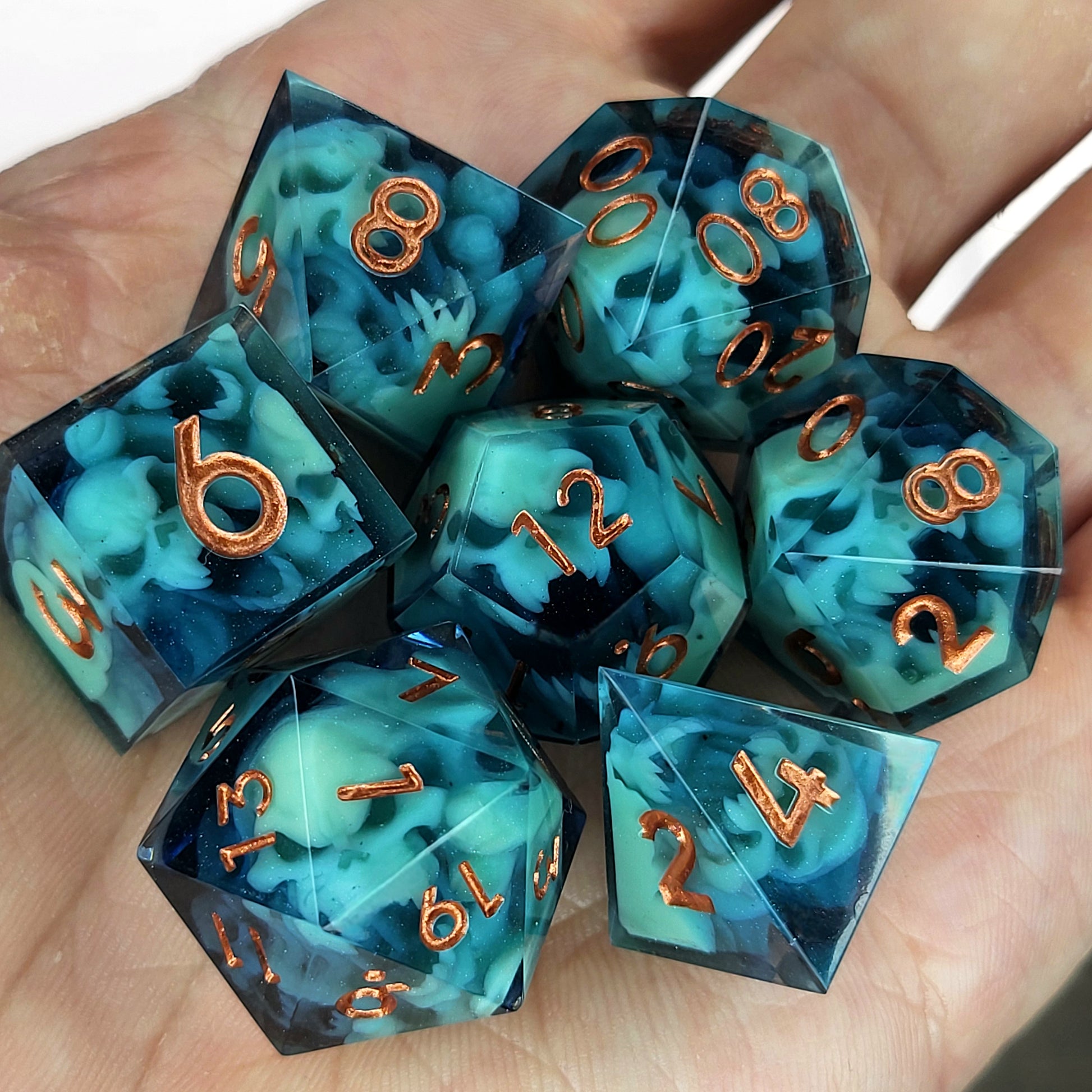 Dice set with green spirit inside and bronze numbers for play dnd , dungeons and dragons