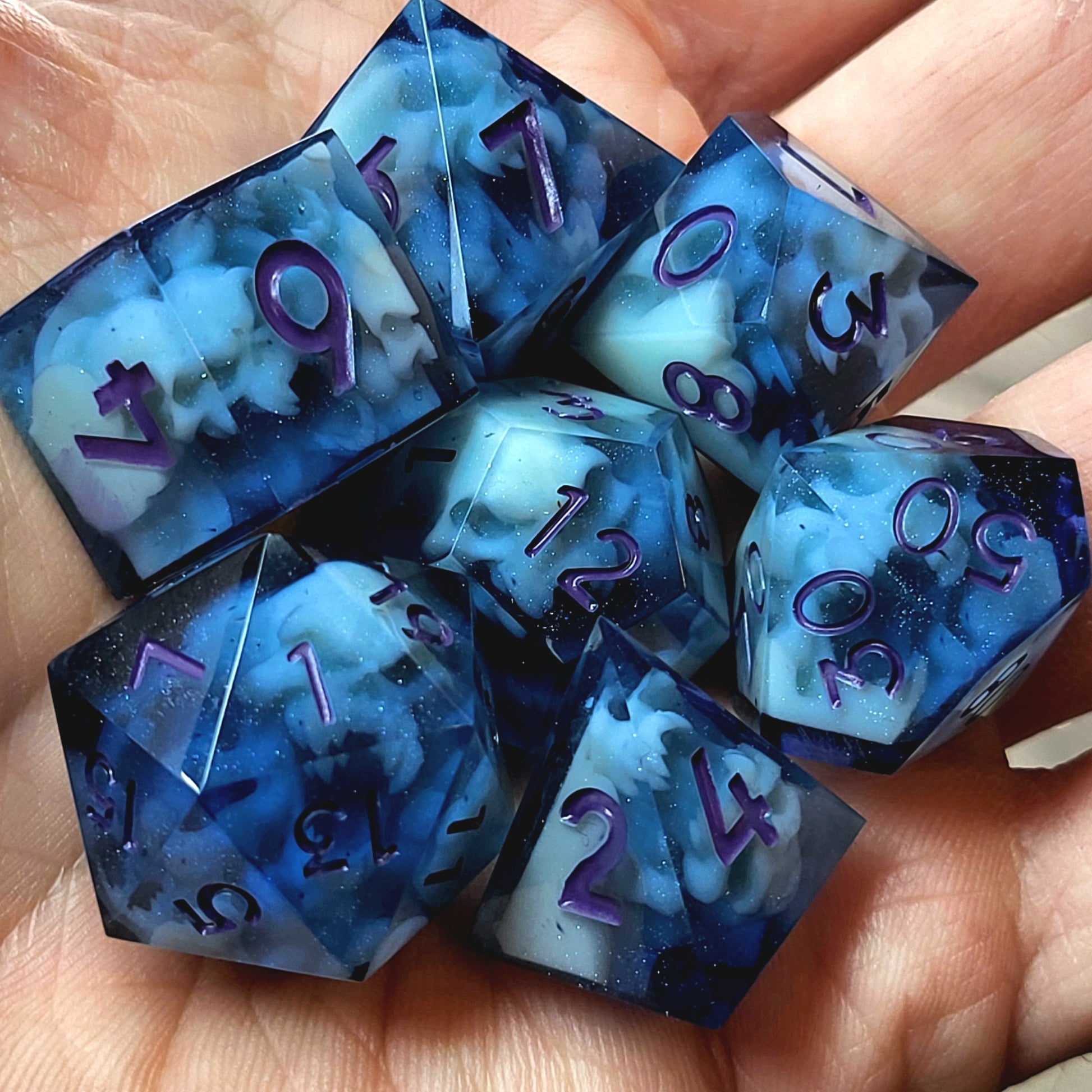 Dice set with light blue spirit inside and purple numbers for play dnd , dungeons and dragons