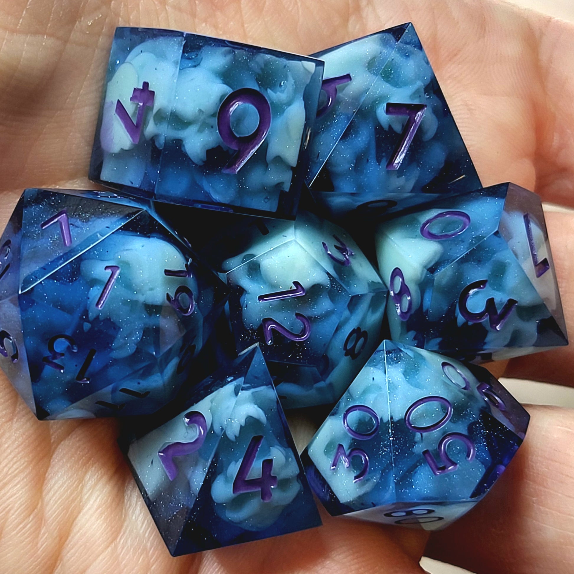 Dice set with light blue spirit inside and purple numbers for play dnd , dungeons and dragons