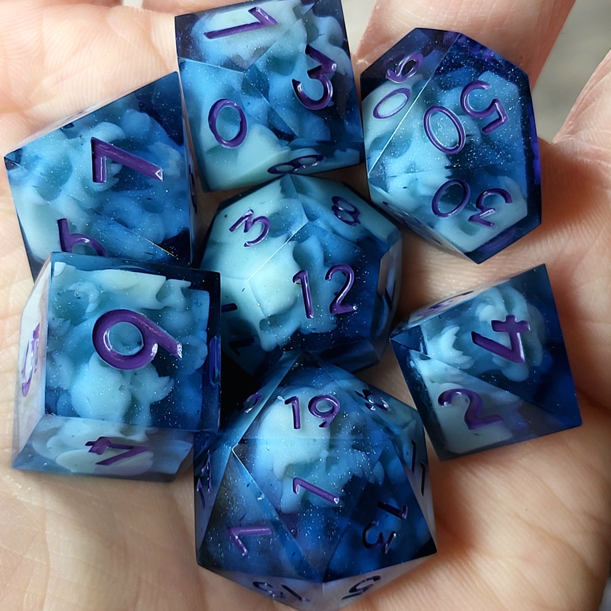 Dice set with light blue spirit inside and purple numbers for play dnd , dungeons and dragons