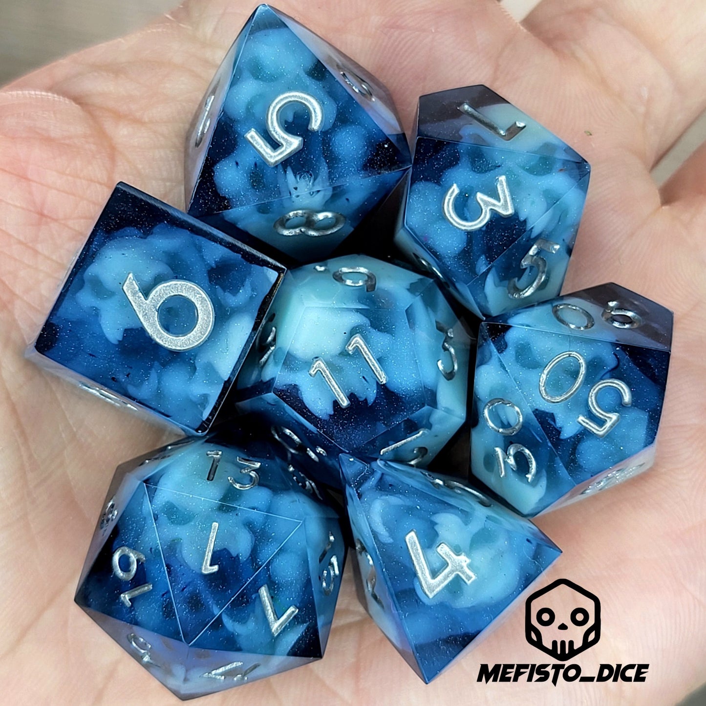 Dice set with light blue spirit inside and silver numbers for play dnd , dungeons and dragons