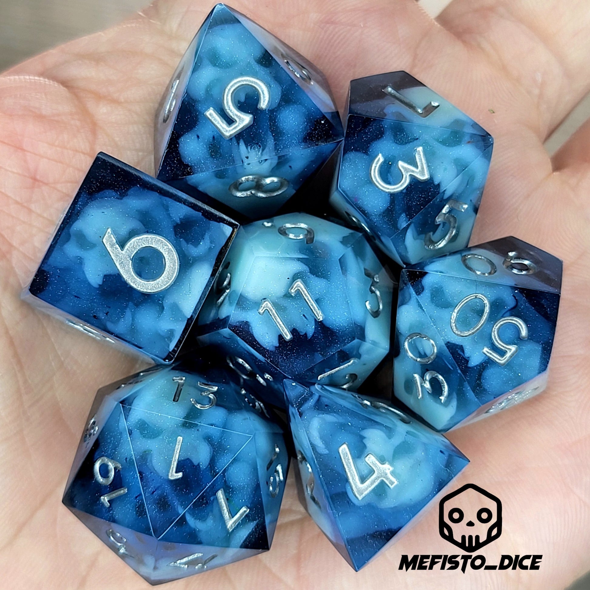 Dice set with light blue spirit inside and silver numbers for play dnd , dungeons and dragons