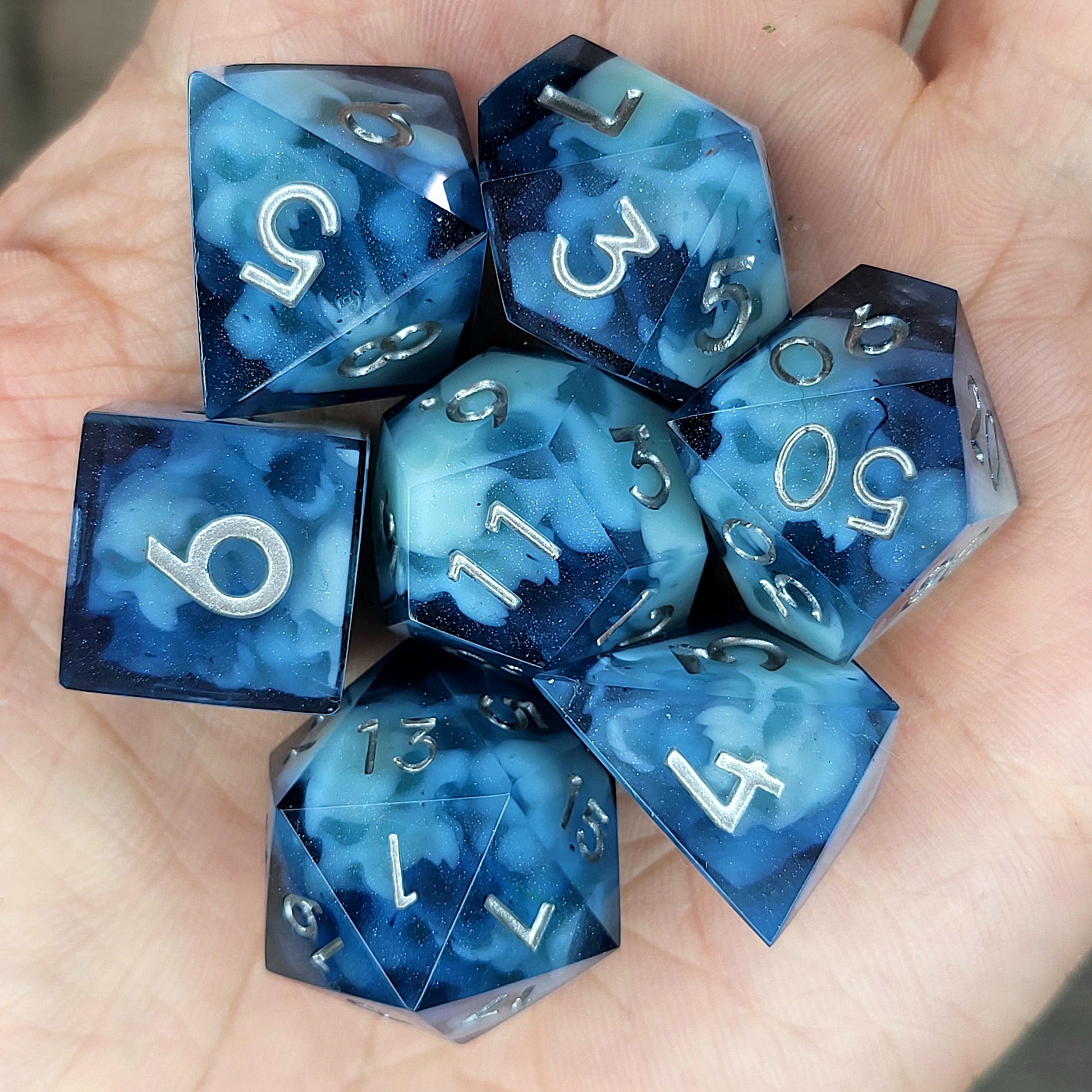 Dice set with light blue spirit inside and silver numbers for play dnd , dungeons and dragons
