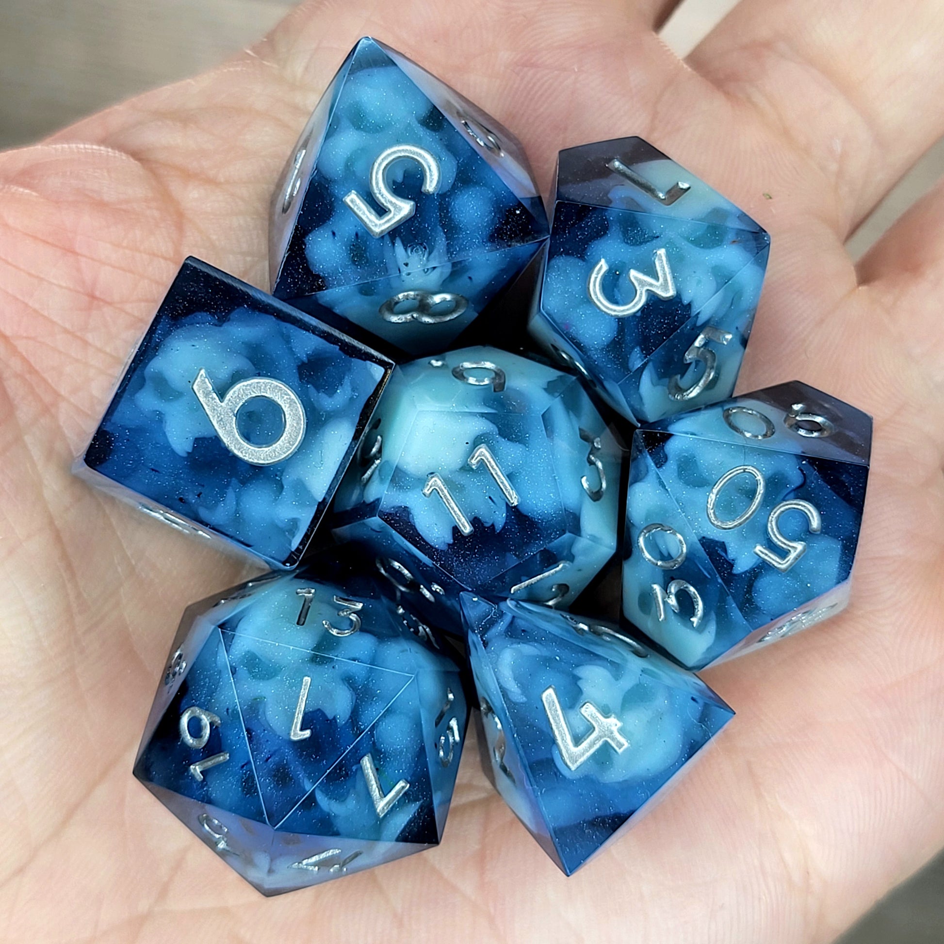 Dice set with light blue spirit inside and silver numbers for play dnd , dungeons and dragons