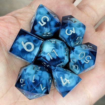 Dice set with light blue spirit inside and silver numbers for play dnd , dungeons and dragons
