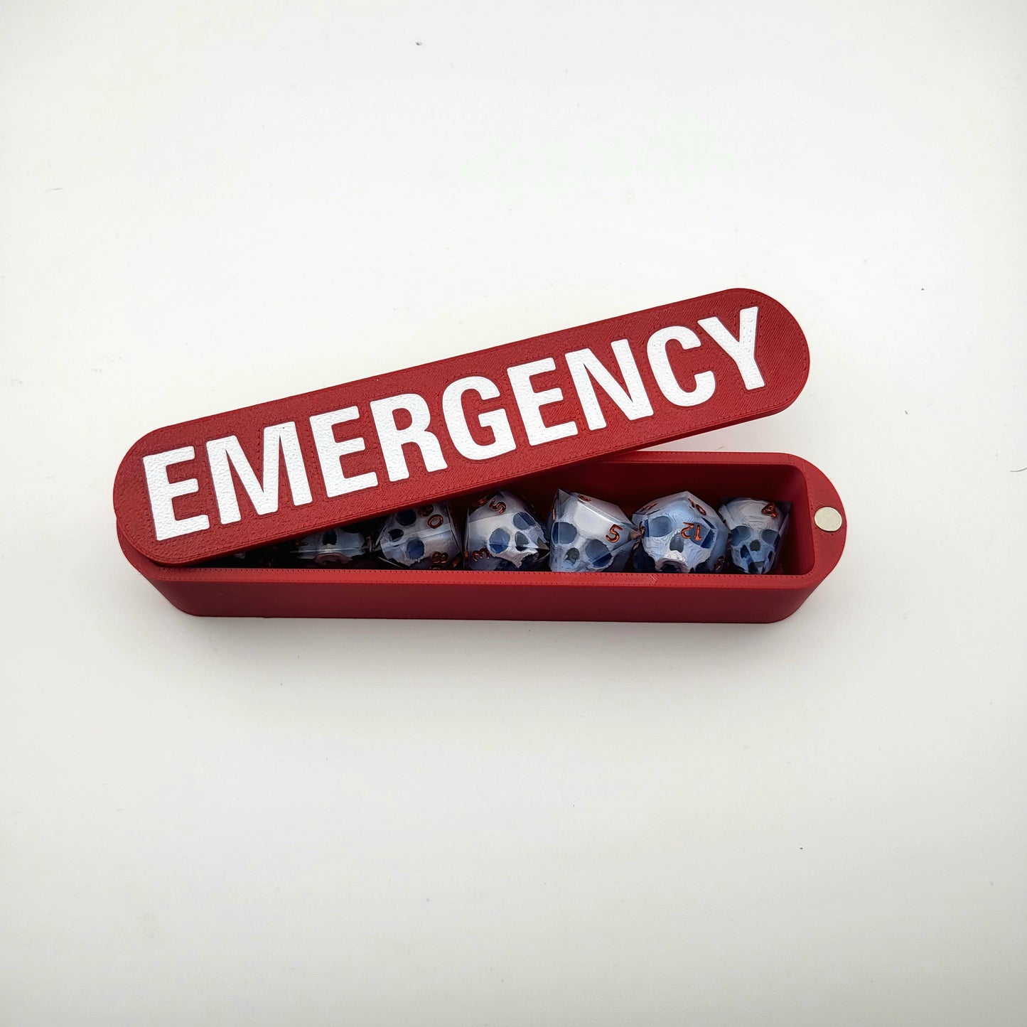 dice box white and red with the word emergency printed on it for dnd and dungeons and dragons games