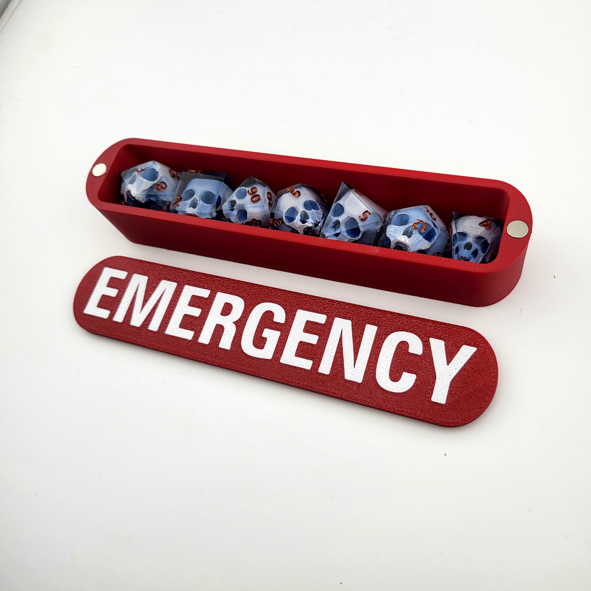 dice box white and red with the word emergency printed on it for dnd and dungeons and dragons games