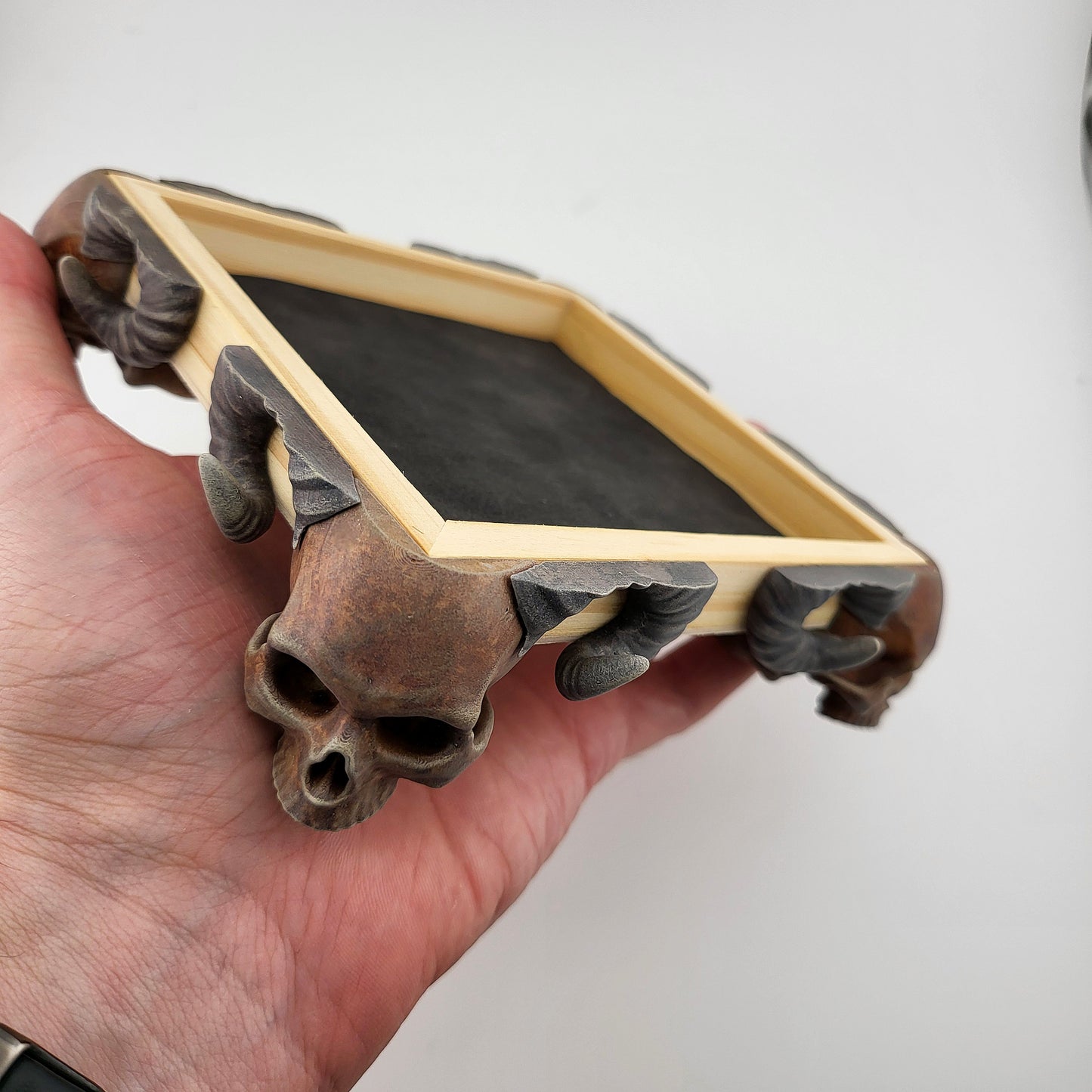 Dice tray with skull feet for dice rolling for tabletop role playing board games